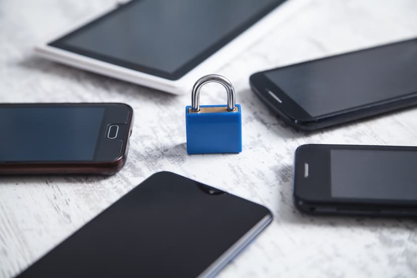 Padlock graphic superimposed over smartphones, symbolizing data security